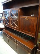 A large reproduction mahogany wall unit with two-door cupboard, pull down drinks cabinet