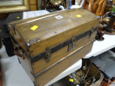 A small wooden dome top chest