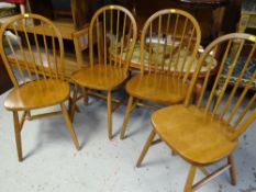 A set of four hardwood spindle back kitchen chairs