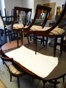 A reproduction mahogany extending dining table & six matching chairs