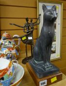 A bronze figure of a couple dancing & a seated cat