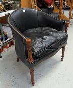 A black leather & studded club chair