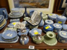 A tray of various coloured Wedgwood Jasperware including table lighters, lidded boxes etc