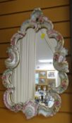 A Meissen-style ornate floral relief framed mirror