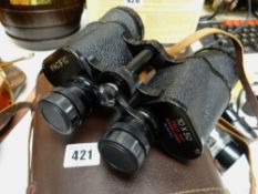 A brown leather cased set of Pacific binoculars