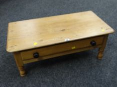 A low pine coffee table with single drawer