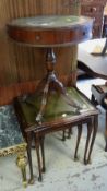 A reproduction leather top drum table, nest of three tables