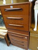 A pair of G-Plan three-drawer bedside cabinets together with another