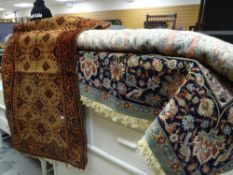 A Persian-style green & blue patterned woollen rug together with a smaller Middle Eastern rug