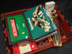 A parcel of various boxed games including Cluedo, Monopoly, Scrabble together with a Rubik's cube