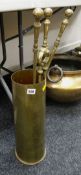 Brass companion set in a brass shell case