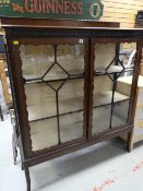 A nice Edwardian mahogany railback display cabinet on raised feet
