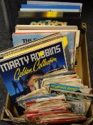 A collection of LP & single records including Elvis Presley, Alice Cooper etc