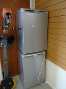 A Beko under counter freezer together with a Beko under counter fridge E/T