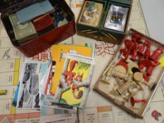A vintage Monopoly set, bone chess pieces, playing cards etc