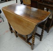 A good vintage oak barley-twist drop leaf dining table, 73 x 92 x 123cms