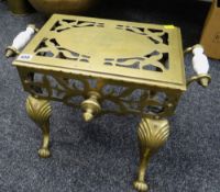 A brass & ceramic-handled footman