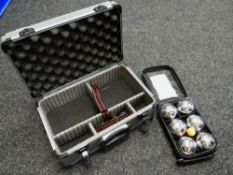 A metal camera carry case & boule set