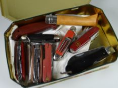 Tin containing a quantity of pen knives & Swiss army knives