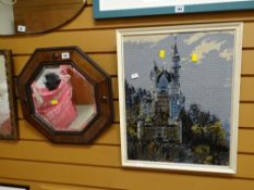 An octagonal beaded oak bevel wall mirror together with a framed woolwork of a castle