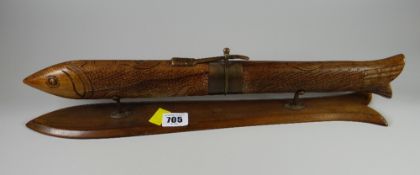 An unusual cased carving set in the shape of a fish on stand