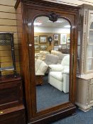 An Edwardian single-mirror door walnut veneered wardrobe, 202 x 103 x 43cms