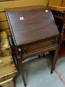 A mahogany narrow drop front bureau