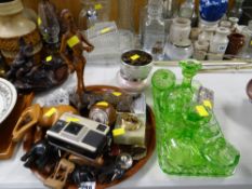 Green glass dressing table set, collection of carved elephants, table lighters etc