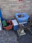 A pair of cast metal bench ends, flower pots etc (outside)