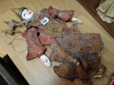 A carved wooden head Indonesian puppet doll