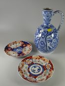 Two Chinese Imari plates together with a Delft jug