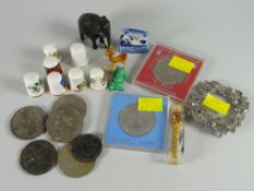 Small box of collectables including Royal Commemorative crowns, collector's thimbles etc