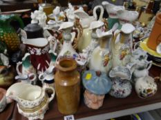 A tray of various decorated mainly Staffordshire jugs etc