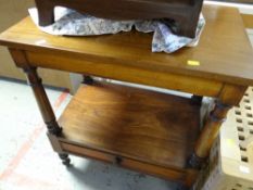 A mahogany two-tier table on turned legs with narrow drawer to base