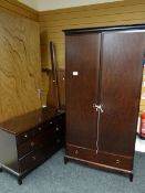A Stag wardrobe together with a chest of drawers, four short over two long