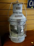 A galvanized metal mast head lamp