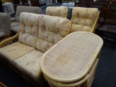 A bamboo & cane conservatory suite with table