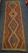 A Suzni Kilim runner, 233 x 70cms