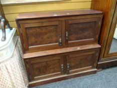 A stained pine two-tier low cupboard