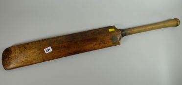 An autographed cricket bat signed by various players (1925-1952)