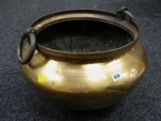 A large metal twin-handled log store / coal bucket