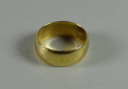 An 18ct gold wedding band