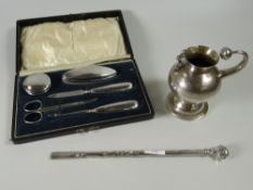 A cased hallmarked silver manicure set together with an Argentinean low grade silver bombilla