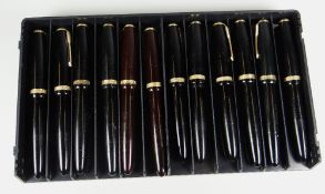 TWELVE VARIOUS VINTAGE PARKER DUOFOLD FOUNTAIN PENS including 10 x black, 2 x brown all with