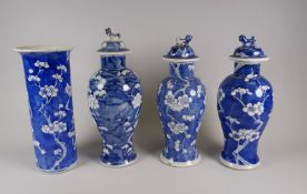 THREE LIDDED CHINESE POTTERY PRUNUS DECORATED BALUSTER VASES & SIMILAR CHIMNEY VASE, the chimney