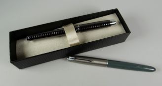 A MODERN BOXED GUNMETAL PARKER FOUNTAIN PEN with cube design together with a vintage grey Parker