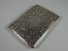 A CASED VICTORIAN SILVER CARD CASE / PURSE with profuse leaf engraving and centre monogrammed