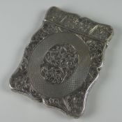 AN EARLY VICTORIAN SILVER CALLING CARD CASE being profuse foliate and later machine decorated with