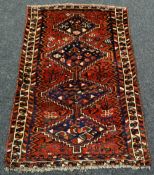 PERSIAN KASHKI TRIBAL RUG red ground, 112 x 165cms