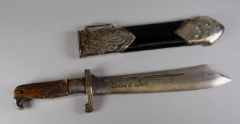 A GERMAN THIRD REICH HEWER DAGGER BY CARL EICKHORN having a clip point steel blade inscribed 'Arbeit
